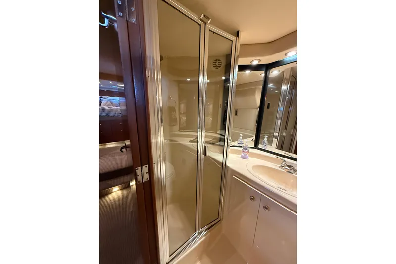  Yacht Photos Pics Bathroom interior of 2005 Meridian 490 Pilothouse yacht with shower and sink.