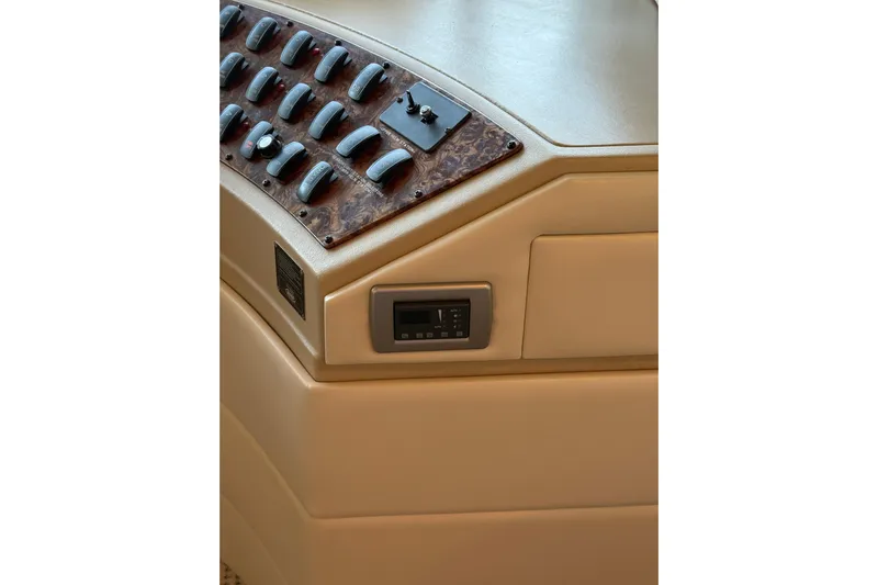 Yacht Photos Pics Control panel of 2005 Meridian 490 Pilothouse yacht with switches and display.