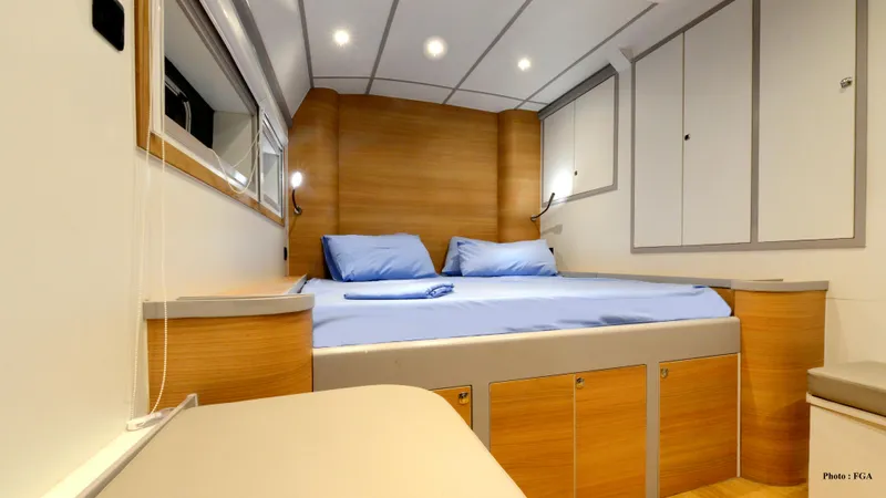 Adventure Yacht Photos Pics Luxurious cabin interior of 2019 Squalt Marine CK 64 yacht with cozy bed and modern design.