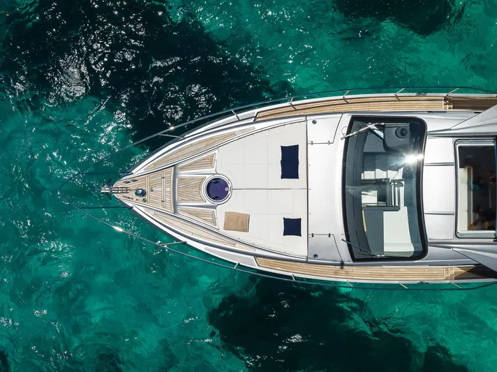 Polar Yacht Photos Pics Aerial view of 2023 Pershing 5x yacht on turquoise water.