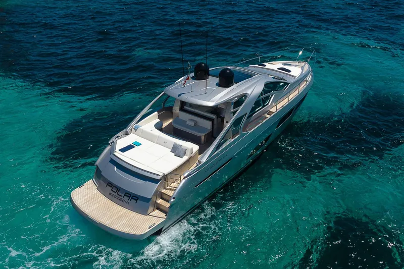 Polar Yacht Photos Pics 2023 Pershing 5x yacht cruising on clear blue ocean waters.