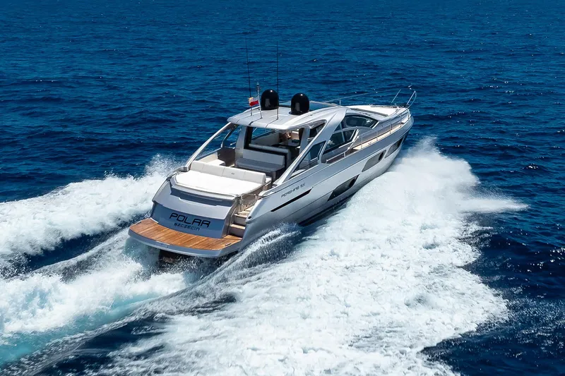 Polar Yacht Photos Pics 2023 Pershing 5x yacht cruising on open blue sea, showcasing sleek design and luxury.