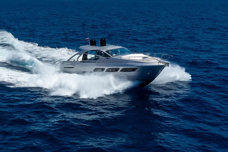 Polar Yacht Photos Pics 2023 Pershing 5x yacht cruising on open sea, creating dynamic waves.