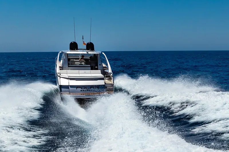 Polar Yacht Photos Pics 2023 Pershing 5x yacht cruising on open sea, creating dynamic waves.