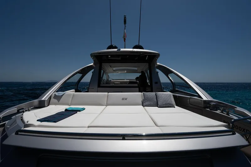 Polar Yacht Photos Pics 2023 Pershing 5x yacht with luxurious sunbed on open sea.