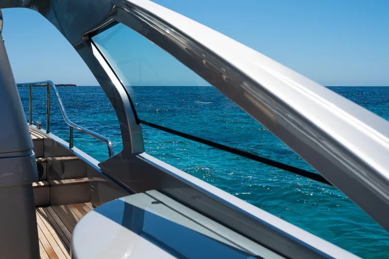 Polar Yacht Photos Pics 2023 Pershing 5x yacht deck with ocean view, showcasing sleek design and clear blue waters.