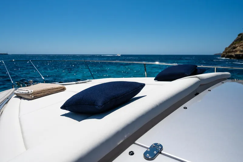 Polar Yacht Photos Pics 2023 Pershing 5x yacht deck with cushions, overlooking the ocean.