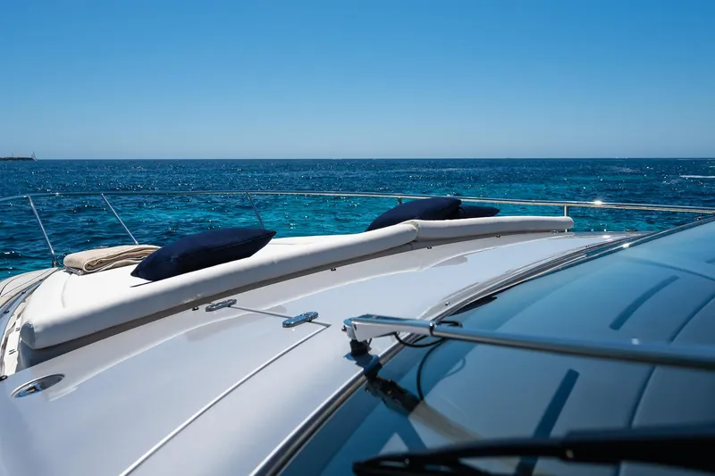 Polar Yacht Photos Pics 2023 Pershing 5x yacht deck with ocean view and clear blue sky.