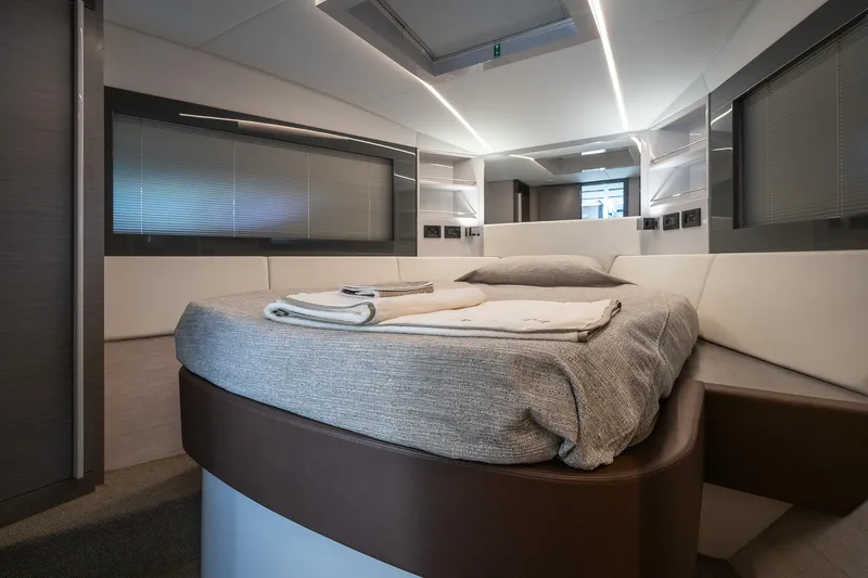 Polar Yacht Photos Pics Luxurious interior of 2023 Pershing 5x yacht with modern bed and sleek design.