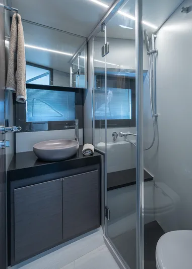 Polar Yacht Photos Pics Modern bathroom in 2023 Pershing 5x yacht with sleek design and glass shower.