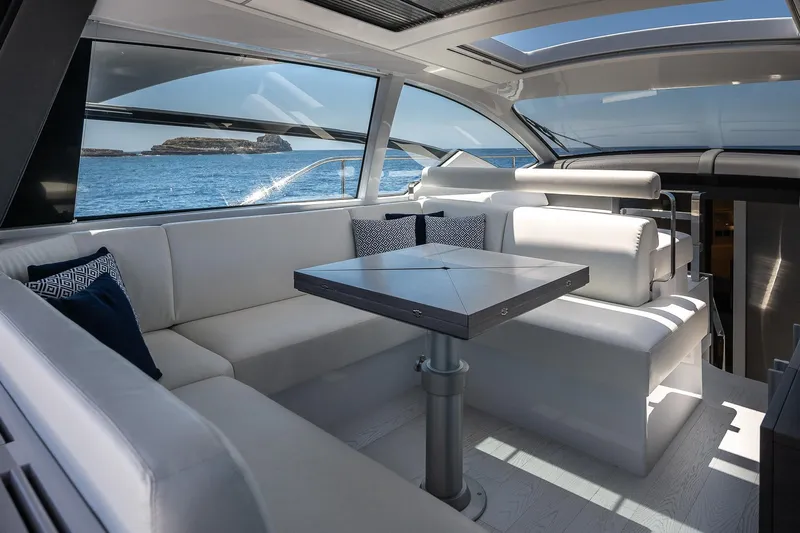 Polar Yacht Photos Pics Luxurious interior of 2023 Pershing 5x yacht with ocean view and modern seating.