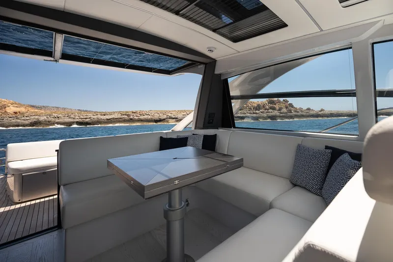 Polar Yacht Photos Pics Luxurious interior of 2023 Pershing 5x yacht with ocean view and modern seating.