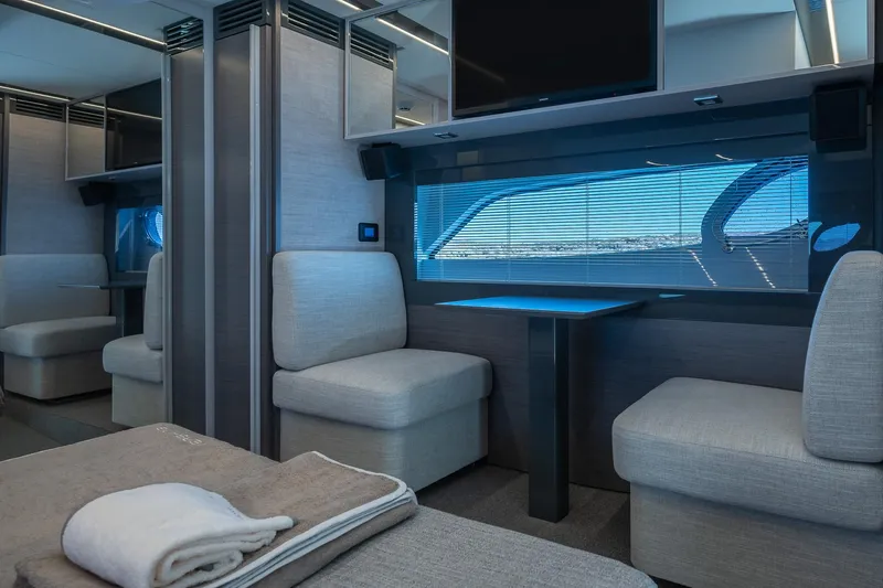 Polar Yacht Photos Pics Luxurious interior of 2023 Pershing 5x yacht with modern seating and sleek design.