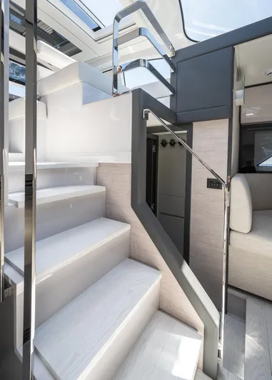 Polar Yacht Photos Pics Interior staircase of 2023 Pershing 5x yacht, featuring modern design and sleek finishes.