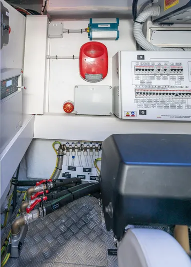 Polar Yacht Photos Pics Engine room of 2023 Pershing 5x yacht with control panels and wiring.