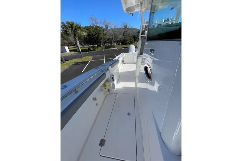  Yacht Photos Pics 2024 Caymas 34 CT boat deck, sleek white design, spacious layout, outdoor setting.