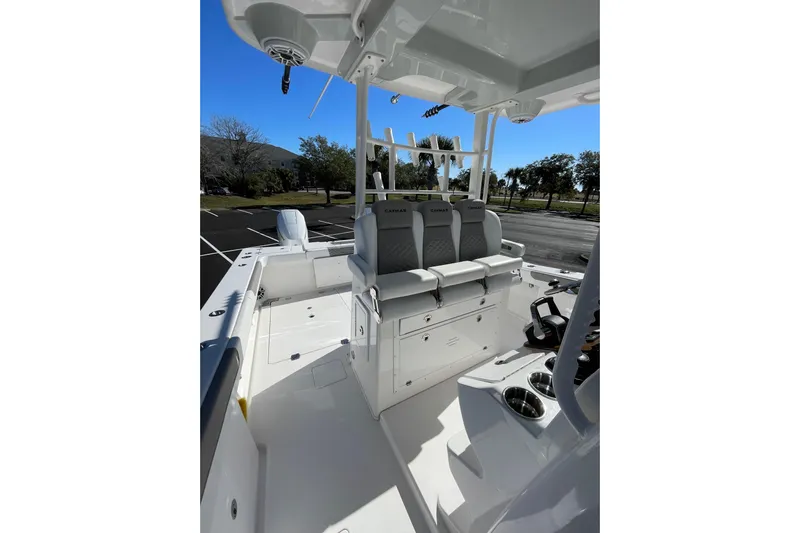  Yacht Photos Pics 2024 Caymas 34 CT boat interior with seating and console, parked outdoors.