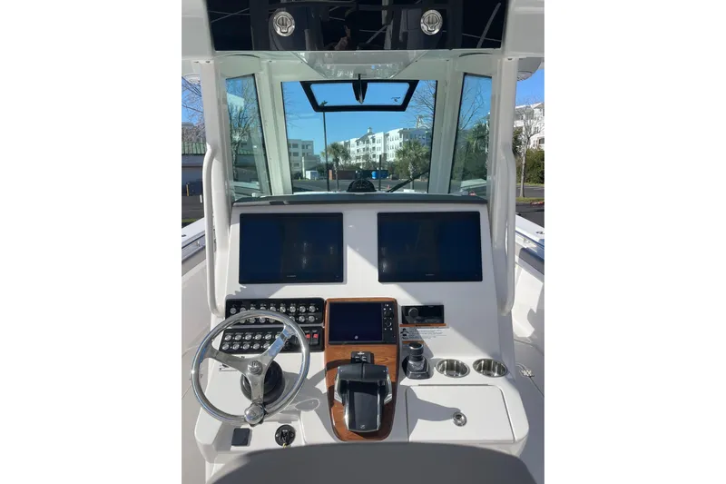  Yacht Photos Pics 2024 Caymas 34 CT boat helm with dual screens and modern controls.