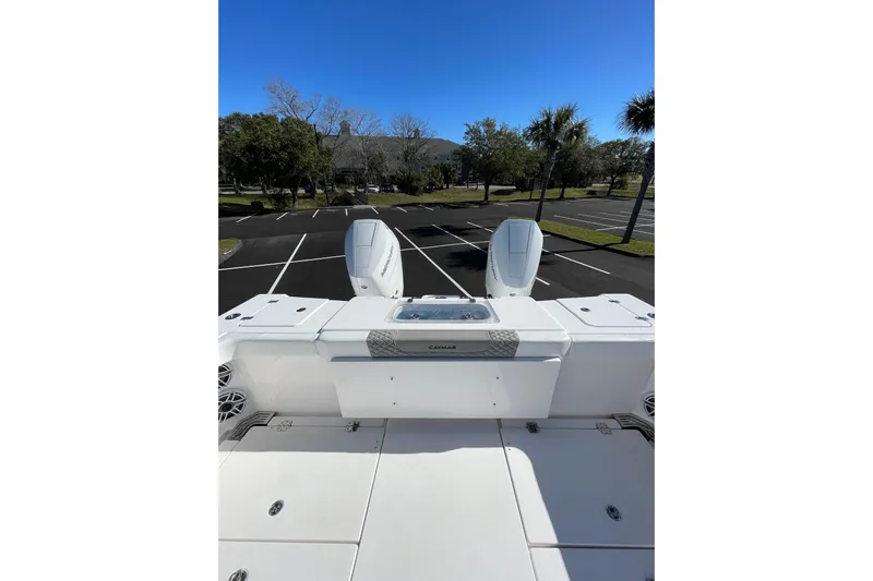  Yacht Photos Pics 2024 Caymas 34 CT boat with dual engines in a parking lot setting.