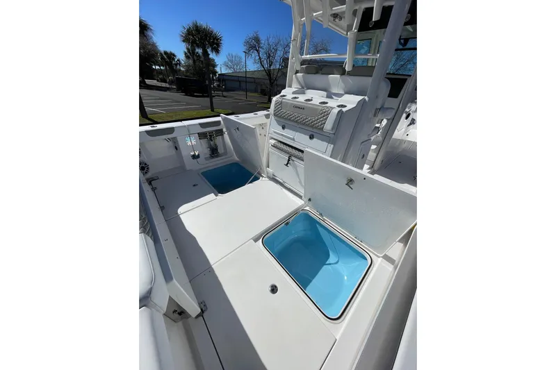  Yacht Photos Pics 2024 Caymas 34 CT boat interior with open storage compartments and seating.