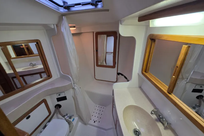 Moana Yacht Photos Pics Bathroom interior of a 1998 Catalina 42 MkII yacht, featuring sink and shower.