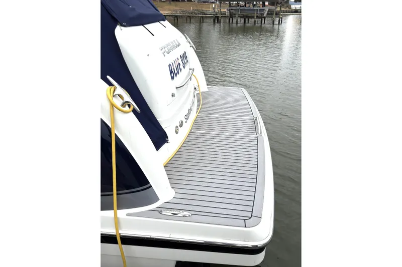 Blue Skye Yacht Photos Pics 2016 Formula 34 Performance Cruiser docked, featuring a spacious swim platform.