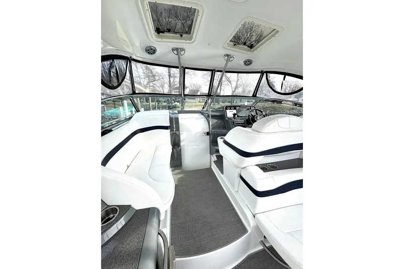 Blue Skye Yacht Photos Pics 2016 Formula 34 Performance Cruiser interior with white seating and modern helm.