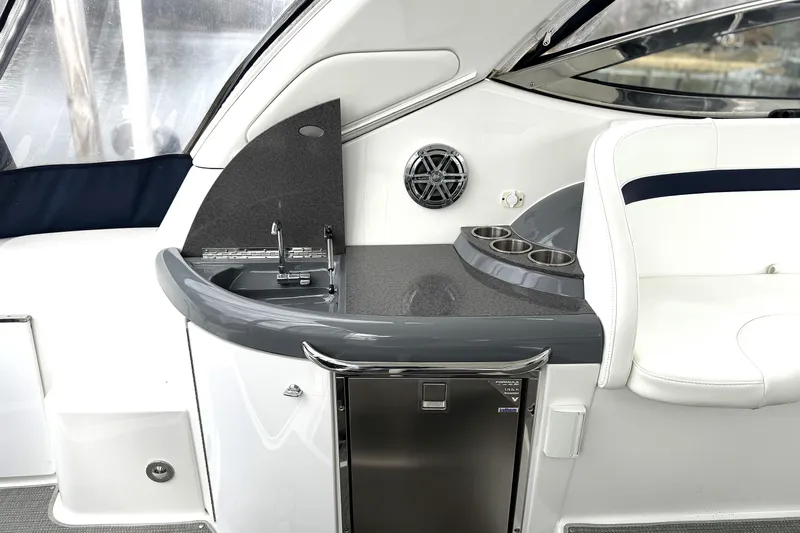 Blue Skye Yacht Photos Pics 2016 Formula 34 Performance Cruiser interior with sink, cup holders, and seating.