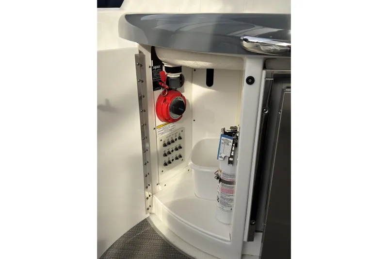 Blue Skye Yacht Photos Pics 2016 Formula 34 Performance Cruiser interior storage with safety equipment and control panel.