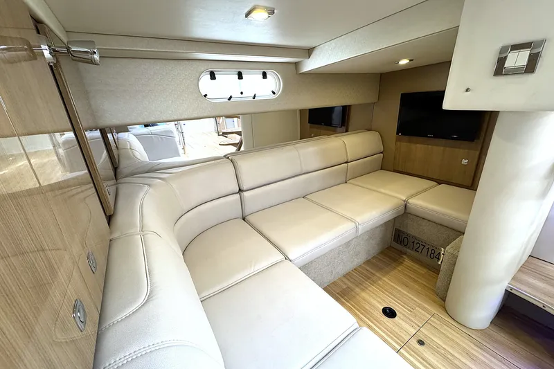 Blue Skye Yacht Photos Pics Luxurious interior of 2016 Formula 34 Performance Cruiser with beige seating and wood accents.