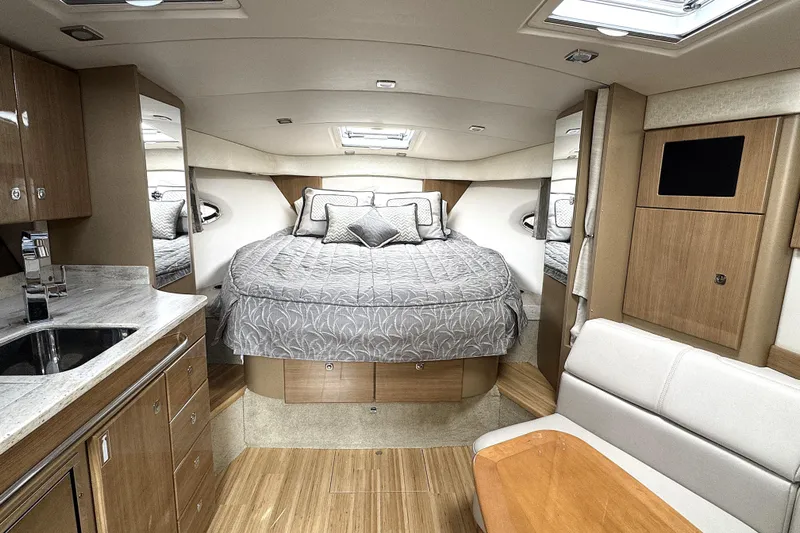 Blue Skye Yacht Photos Pics Luxurious interior of 2016 Formula 34 Performance Cruiser with cozy bed and modern amenities.