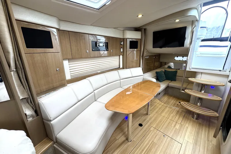 Blue Skye Yacht Photos Pics Luxurious interior of 2016 Formula 34 Performance Cruiser with modern seating and wooden finishes.