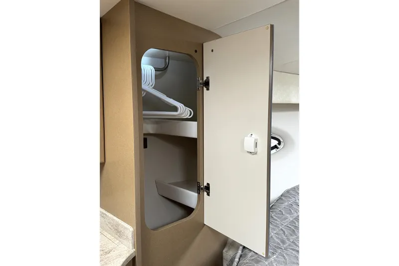 Blue Skye Yacht Photos Pics 2016 Formula 34 Performance Cruiser interior closet with hangers and open door.