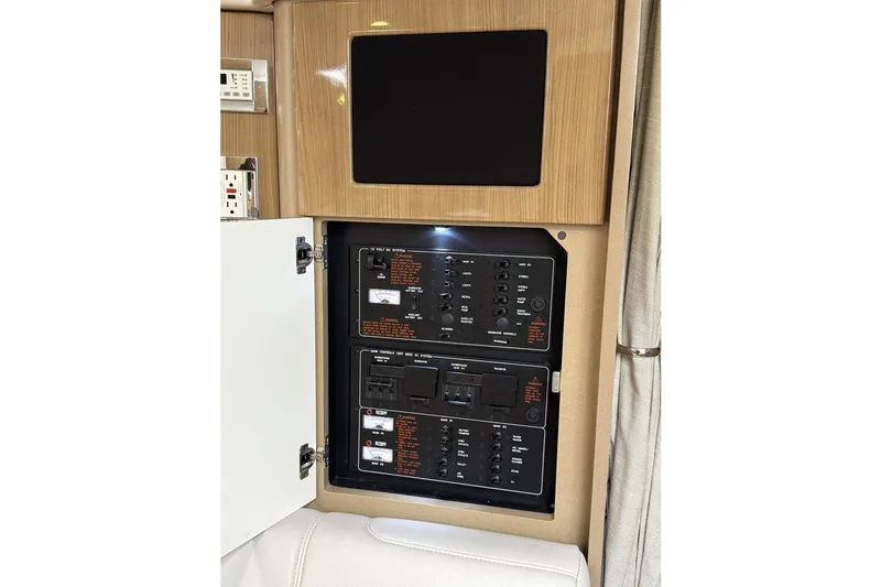 Blue Skye Yacht Photos Pics 2016 Formula 34 Performance Cruiser electrical panel with open cabinet door.