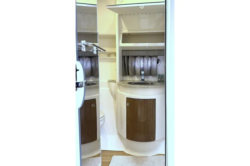 Blue Skye Yacht Photos Pics 2016 Formula 34 Performance Cruiser bathroom interior with sink and storage.