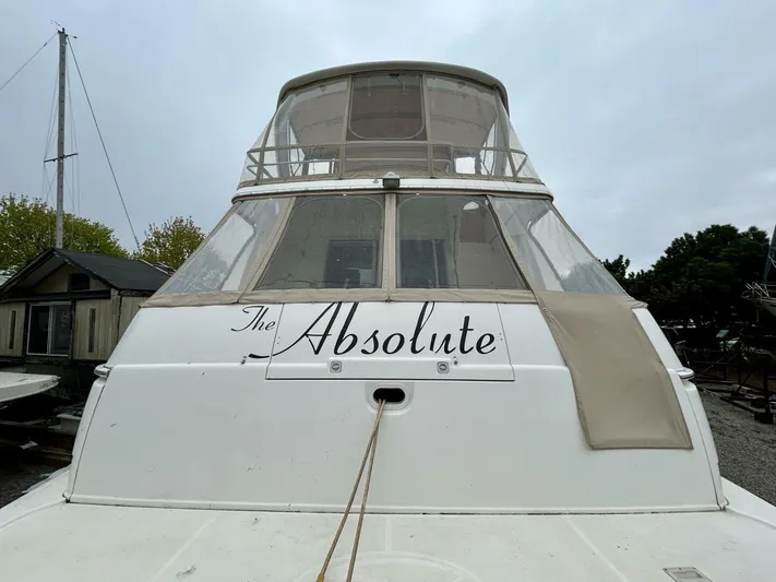  Yacht Photos Pics 2001 Silverton 410 Sport Bridge yacht named "The Absolute" docked outdoors.