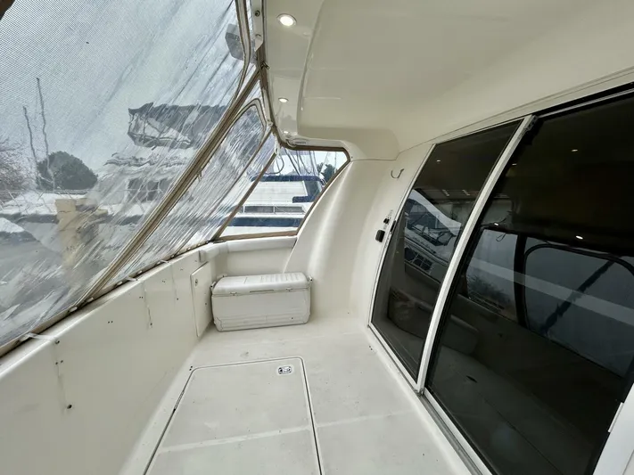  Yacht Photos Pics 2001 Silverton 410 Sport Bridge yacht interior with spacious deck and sliding glass doors.