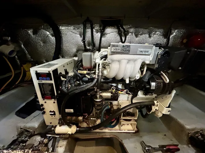  Yacht Photos Pics Engine room of a 2001 Silverton 410 Sport Bridge yacht, showcasing mechanical components.