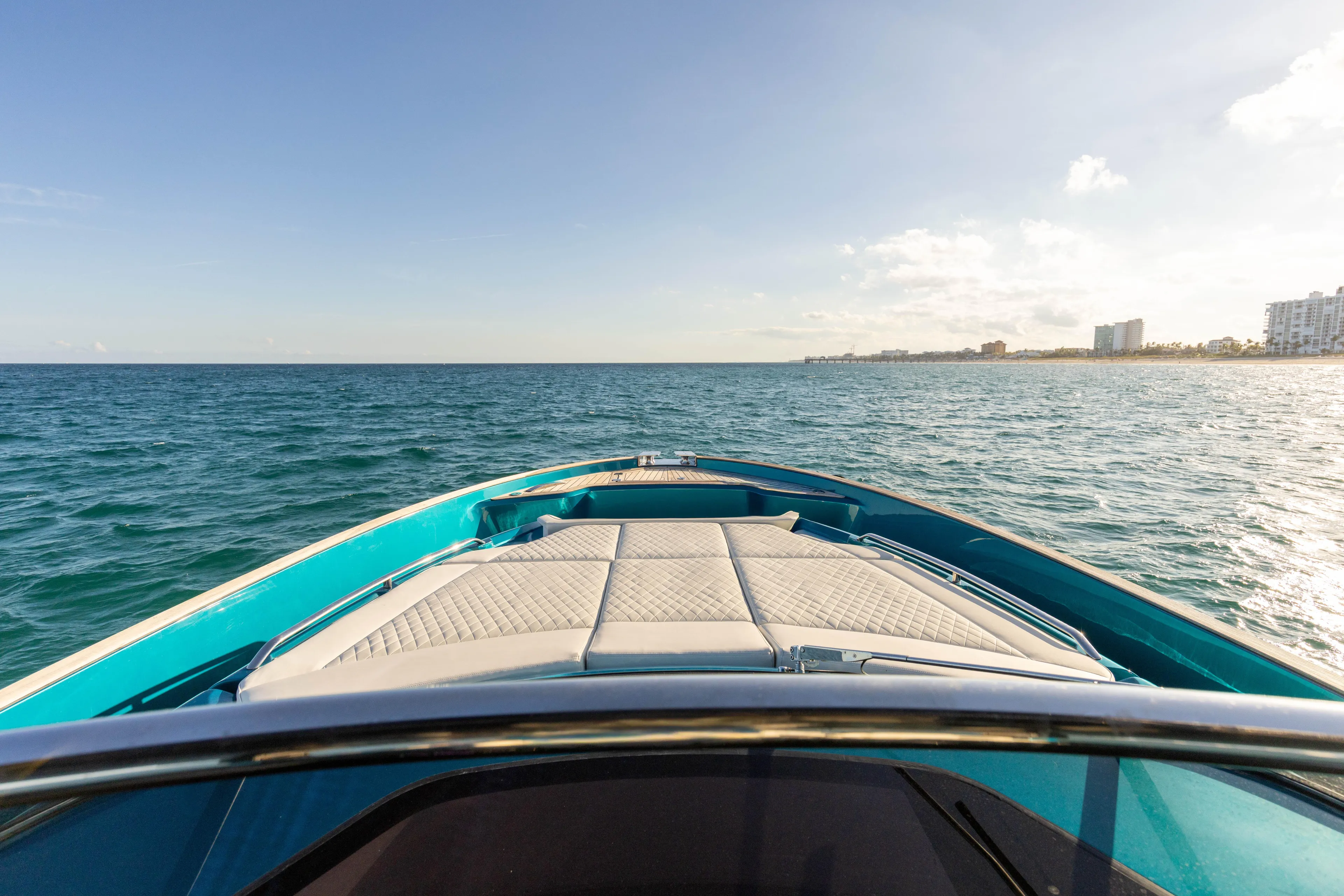  Yacht Photos Pics 2024 Solaris Power 52 Open yacht cruising on open sea under clear sky.
