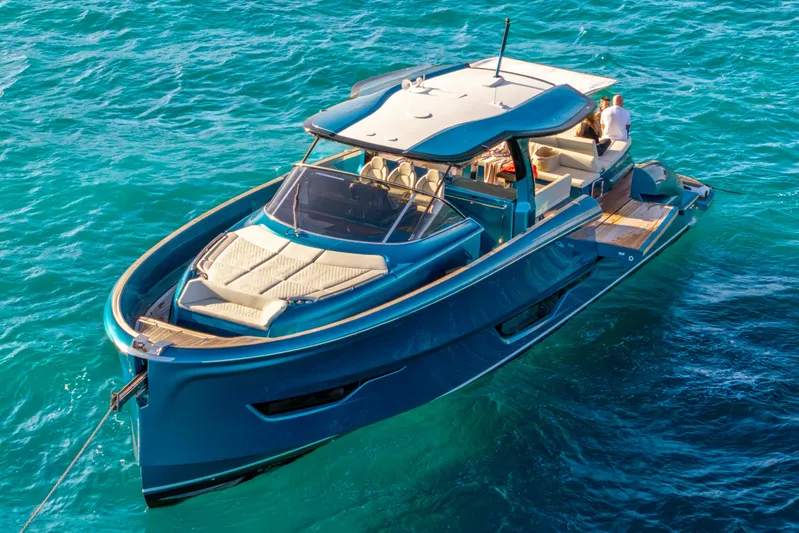  Yacht Photos Pics 2024 Solaris Power 52 Open yacht on clear blue water, showcasing luxury design.