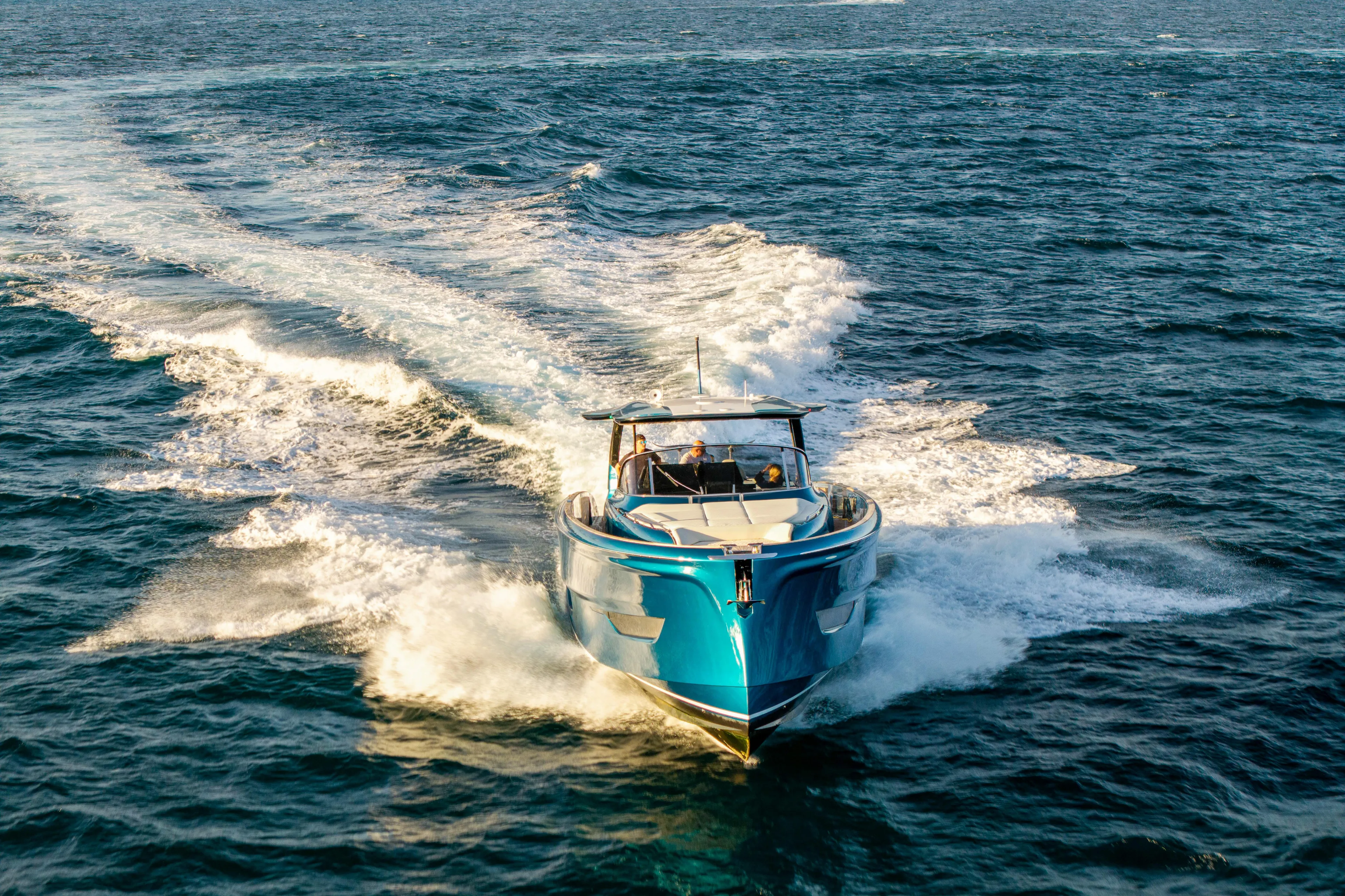  Yacht Photos Pics 2024 Solaris Power 52 Open yacht cruising on open sea, creating dynamic waves.