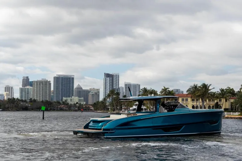  Yacht Photos Pics 2024 Solaris Power 52 Open yacht cruising near city skyline.