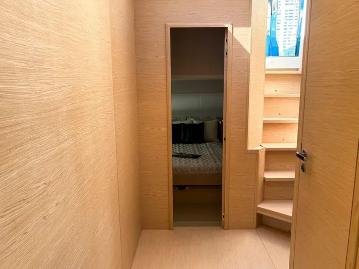  Yacht Photos Pics Interior cabin of 2024 Solaris Power 52 Open yacht with wooden finish and stairs.