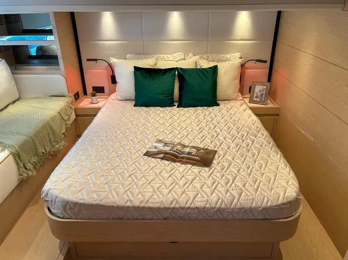  Yacht Photos Pics Luxurious bedroom interior of 2024 Solaris Power 52 Open yacht with modern decor.