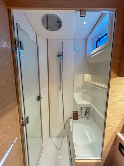 Yacht Photos Pics Modern bathroom in 2024 Solaris Power 52 Open yacht with glass shower enclosure.