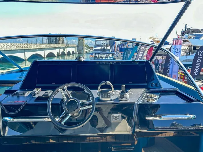  Yacht Photos Pics Helm of 2024 Solaris Power 52 Open yacht with modern navigation equipment.