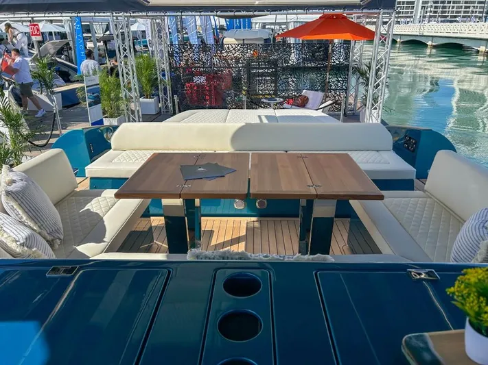  Yacht Photos Pics 2024 Solaris Power 52 Open luxury yacht with elegant seating and dining area.