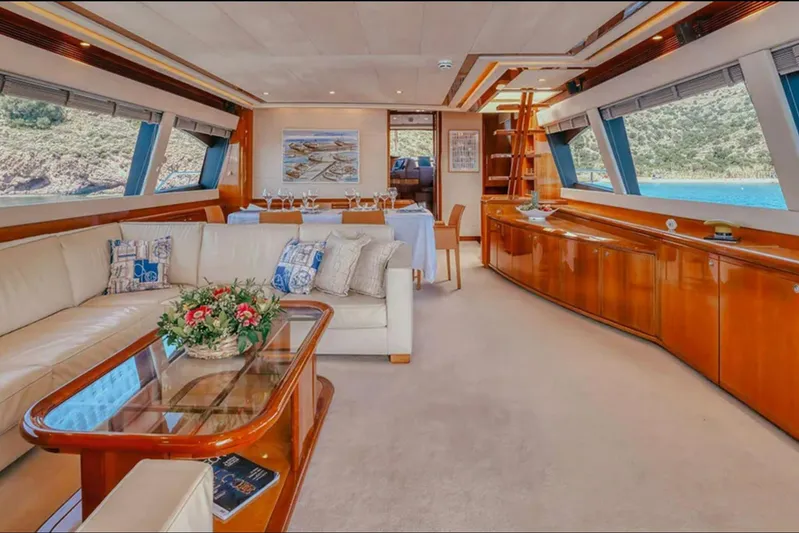 Lidia Yacht Photos Pics Luxurious interior of a 2006 Ferretti Yachts 830 with elegant seating and scenic views.