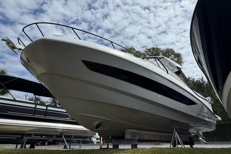  Yacht Photos Pics 2024 Beneteau Flyer 10 boat displayed outdoors under a partly cloudy sky.
