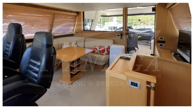  Yacht Photos Pics Luxurious interior of 2008 Ferretti Yachts Customline Navetta 26 with leather seating and wooden accents.